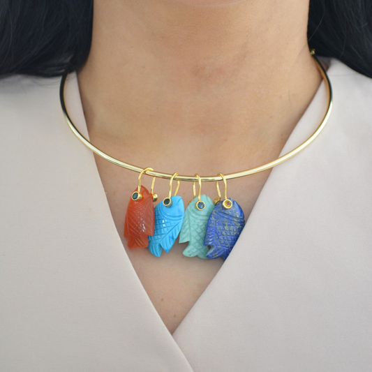 Woman wearing Fish Pendant Necklace with gold jewelry