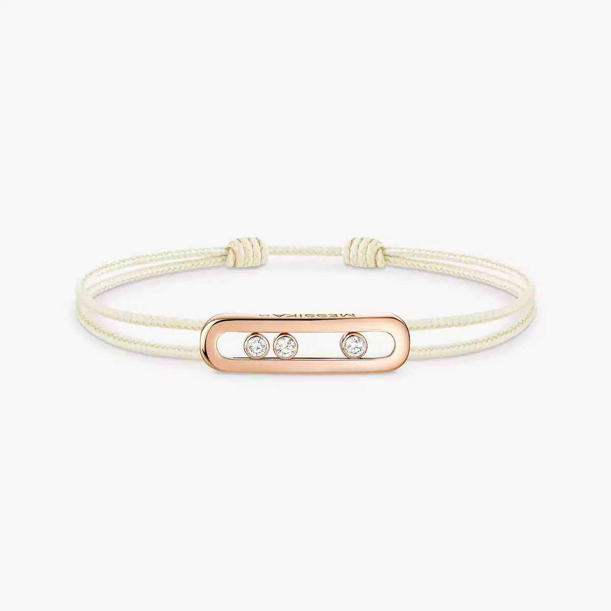 Cream double-cord bracelet with a rose gold-tone oblong plate set with three small clear stones, on white