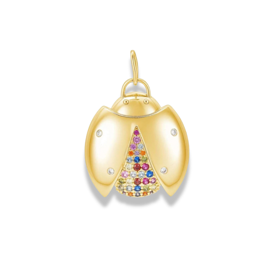 Gold-tone ladybug charm with a center panel of tiny multicolor stones, flat on white