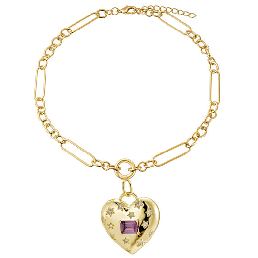 Gold-tone link chain with a heart charm hanging from a round ring and an extender chain, on white