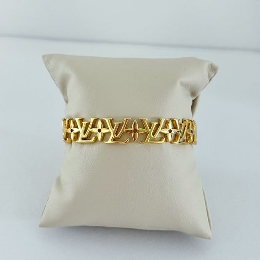 L Gold Bangle detail for stacked bracelet styling