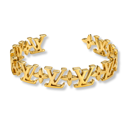 L Gold Bangle by MARO polished gold-tone statement bracelet
