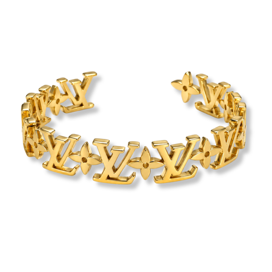 L Gold Bangle by MARO polished gold-tone statement bracelet