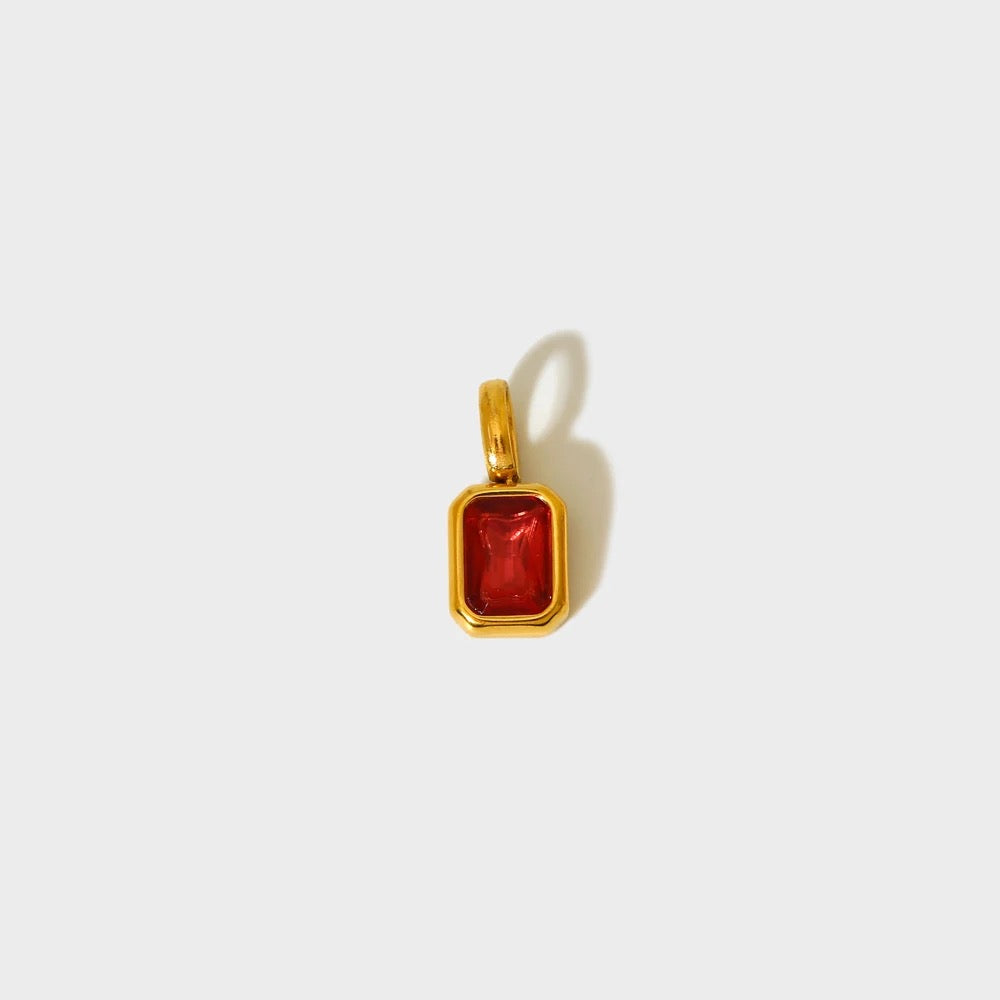 Deep red birthstone charm in a gold-plated rectangular bezel — MARO Jewelry.