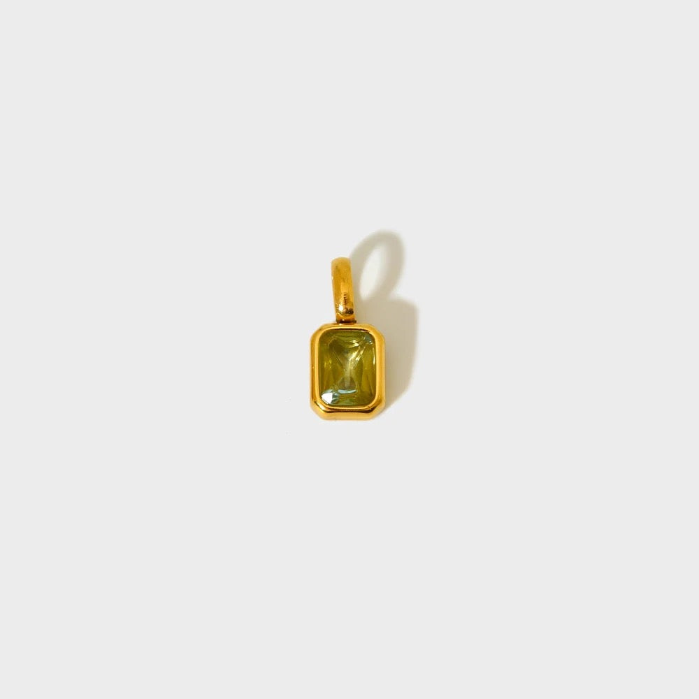 Light green birthstone charm in a gold-plated rectangular bezel — MARO Jewelry.