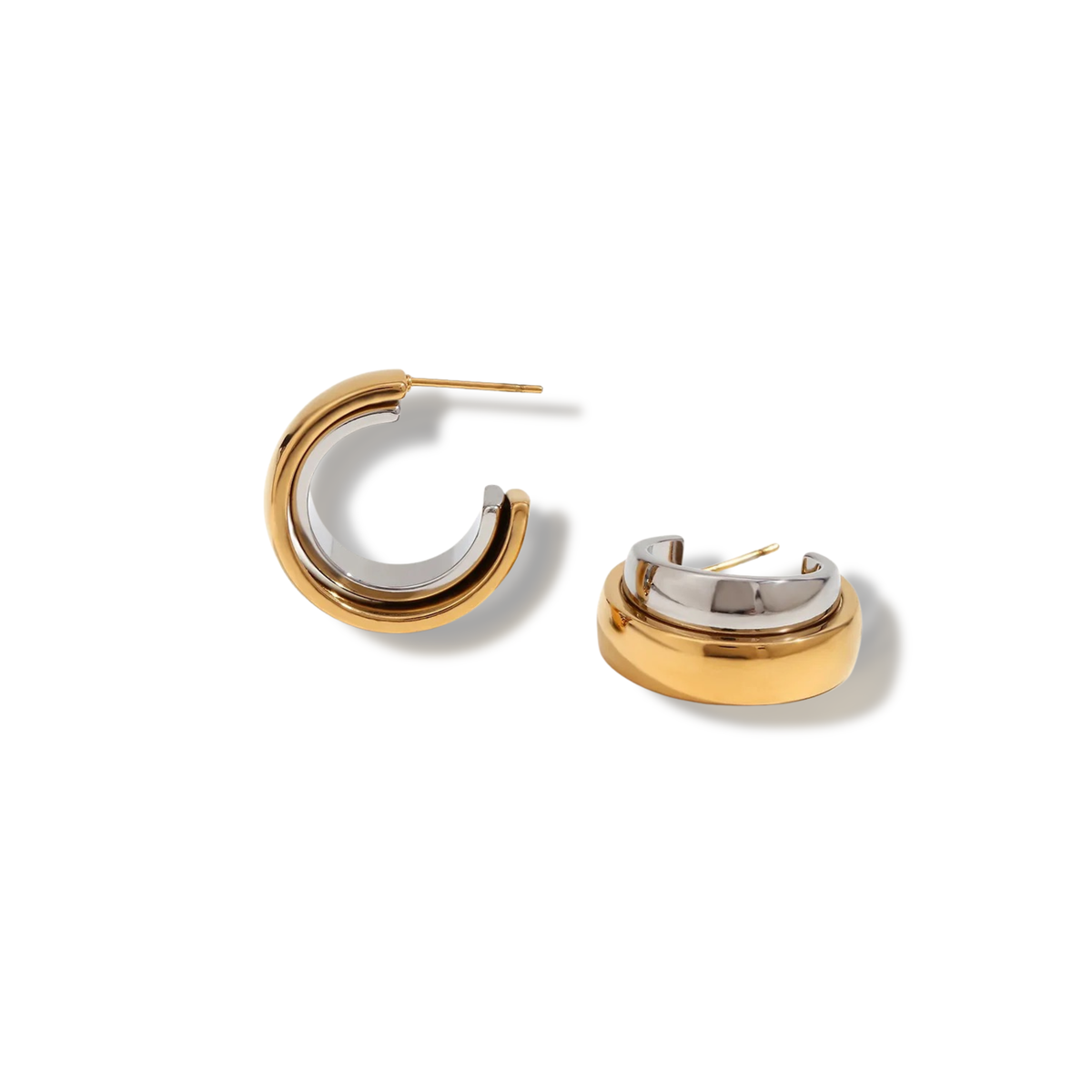 Pair of thick open C-shaped hoops with a gold-tone outside and a silver-tone inside, on white