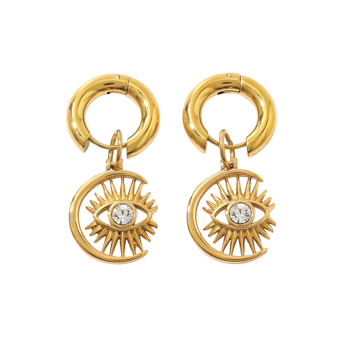 Pair of chunky gold-colored huggie hoops with crescent eye charms on a black background