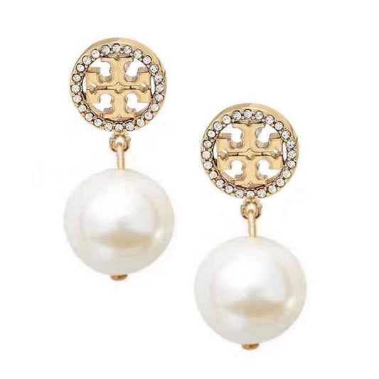 Pair of drop earrings with large cream pearl-style beads hanging from round gold-tone discs edged in stones
