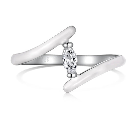 Silver-tone ring with two glossy white overlapping ends and a marquise-shaped clear stone in the middle