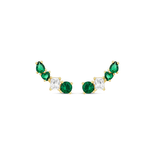 Pair of ear crawler earrings with a curved line of green and clear stones in gold-tone settings, on white