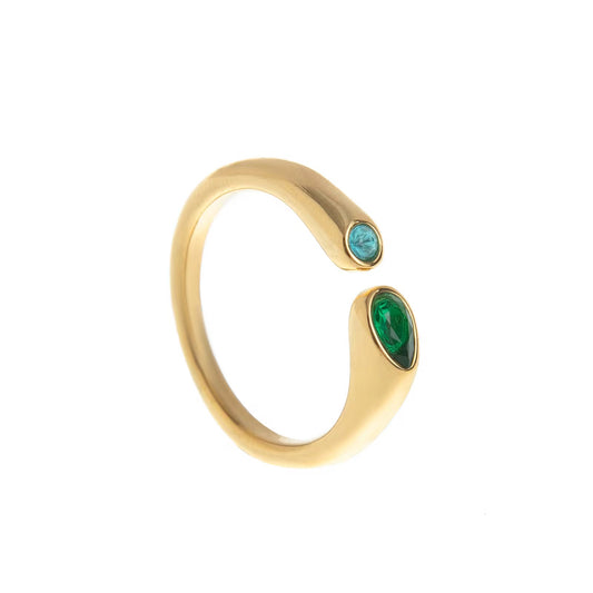 Anillo abierto de color dorado con circonia, una piedra de color turquesa y una piedra verde en forma de gota en los extremos