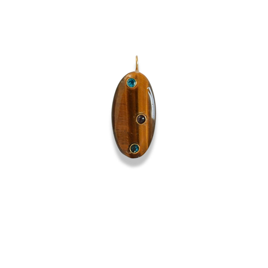 Oval tiger's eye charm in warm golden-brown with three small stones set in, hanging from a gold-tone hook