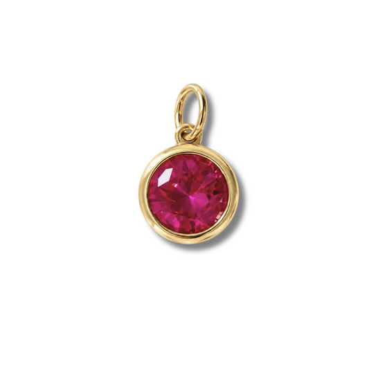 Dije redondo de piedra rosa fucsia en un engaste pulido en tono dorado con una argolla