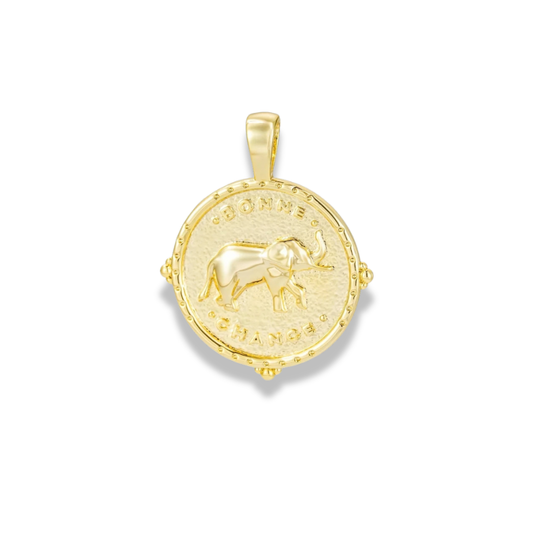 Round gold-tone medallion charm with an elephant in relief and lettering around the edge