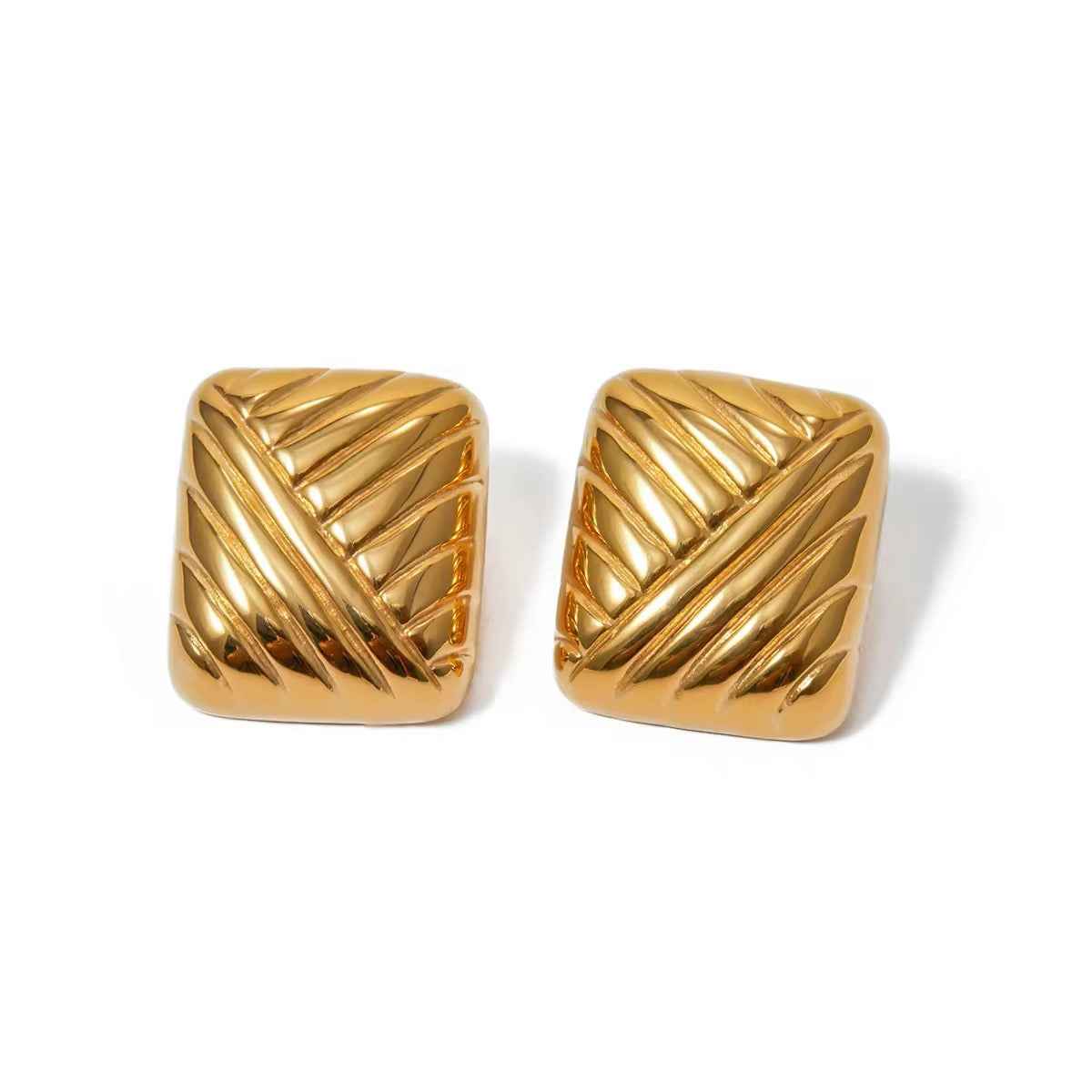 Pair of square gold-tone stud earrings with raised crisscross ridges, flat on white