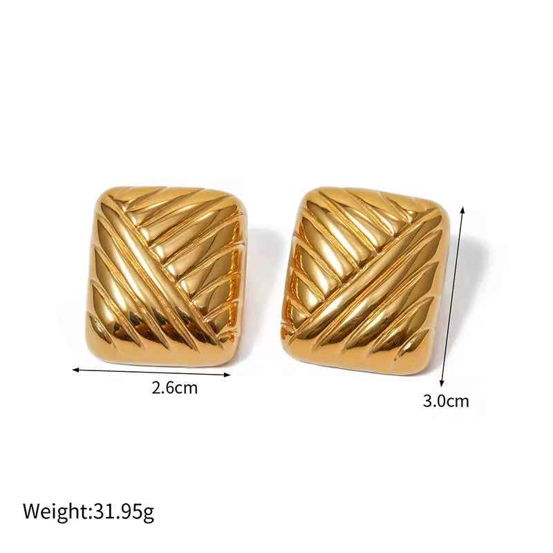 Pair of square ridged gold-tone studs with size measurements marked beside them