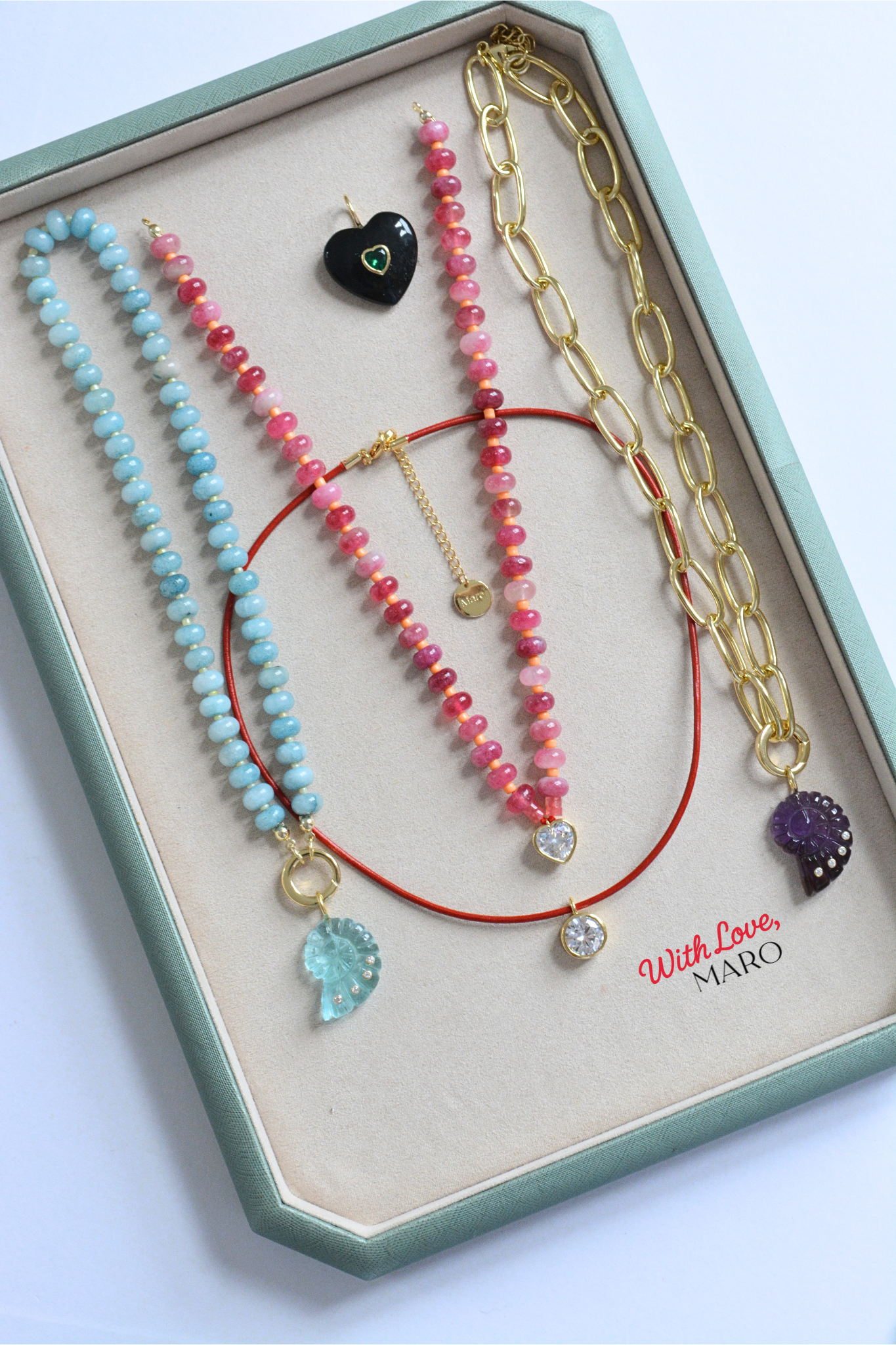 MARO Sunset Love Necklace with pink beads, warm sunset tones and a heart charm detail.