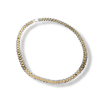 Two-tone watch-link chain necklace laid in a loop